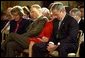 President George W. Bush and Laura Bush bow their heads in prayer during a ceremony marking today as the National Day of Prayer in the East Room Thursday, May 1, 2003. "Today we recognize the many ways our country has been blessed, and we acknowledge the source of those blessings. Millions of Americans seek guidance every day in prayer to the Almighty God. I am one of them," said the President in his remarks. White House photo by Tina Hager
