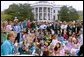 Lynne Cheney reads from her book, "America: A Patriotic Primer," at the White House Easter Egg Roll Monday, April 21, 2003. Accompanying Mrs. Cheney, several Cabinet members and authors also read to children during the day. White House photo by Susan Sterner