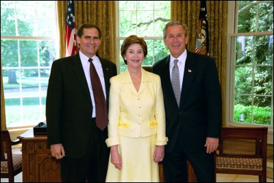 President George W. Bush and Laura Bush congratulate 2003 Maine Teacher of the Year James Kerr in the Oval Office Wednesday, April 30, 2003. White House Photo by Eric Draper