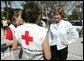 Laura Bush speaks with American Red Cross Disaster Relief workers outside of the Vero Beach Community Center where disaster relief family services are offered to local residents in Vero Beach, Fla., Friday, Oct. 1, 2004. Vero Beach, Fla., was one of the areas hardest hit by Hurricanes Jeanne and Frances. White House photo by Joyce Naltchayan.