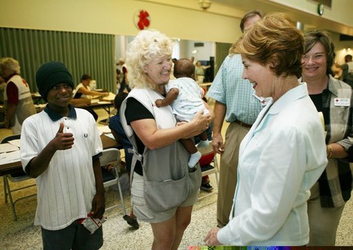 Laura Bush visits with local residents and volunteer workers at the Red Cross Disaster Relief Family Services. located at the Vero Beach Community Center in Vero Beach, Fla., Friday, Oct. 1, 2004. The City of Vero Beach was one of the areas hardest hit by Hurricanes Jeanne and Frances. White House photo by Joyce Naltchayan.