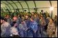 To show his support for America’s troops, President Bush makes a surprise visit to Iraq and shares Thanksgiving Dinner with U.S. troops at the Bob Hope Dining Facility, Baghdad, Iraq, Nov. 27, 2003. White House photo by Tina Hager.