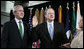 President George W. Bush attends the ceremonial swearing-in of Director of National Intelligence J. Michael “Mike” McConnell, Tuesday, Feb. 20, 2007 at Bolling Air Force Base in Washington, D.C., taking his oath of office as McConnell’s wife, Terry, holds the Bible. White House photo by Paul Morse