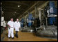 President George W. Bush is escorted on a tour of the fermentation room by David Pace at Novozymes North America, Inc., Thursday, Feb. 22, 2007 in Franklinton, N.C., where cellulosic ethanol is being produced from bio mass materials. White House photo by Paul Morse