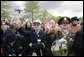 World War II veterans acknowledge President and Mrs. Bush Sunday, May 8, 2005, during a celebration at the Netherlands American Cemetery in Margraten, in remembrance of those who served during World War II. White House photo by Eric Draper