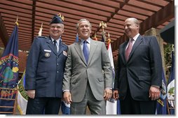 President George W. Bush stands with Ambassador John Negroponte and Lt. Gen. Michael Hayden after they were sworn in as the Director and Deputy Directory of National Intelligence at the New Executive Office Building Wednesday, May 18, 2005. White House photo by Paul Morse