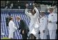 A U.S. Naval Academy graduate yells for joy after receiving her diploma in Annapolis, Md., Friday, May 27, 2005. White House photo by Paul Morse