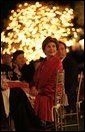 Laura Bush listens to a mariachi band perform during the White House celebration of Cinco de Mayo songs in the Rose Garden of the White House Wednesday, May 4, 2005. White House photo by Paul Morse