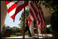 President George W. Bush walks to the podium in the Rose Garden before the start of a morning press availability Tuesday, May 31, 2005. White House photo by Paul Morse