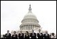 President George W. Bush stands during the national anthem at the Annual Peace Officers' Memorial Service at the U.S. Capitol on Sunday, May 15, 2005. White House photo by Krisanne Johnson