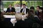 President George W. Bush and Prime Minister Jan Peter Balkenende of The Netherlands, smile as they answer questions during a youth roundtable Sunday, May 8, 2005, in Valkenburg, Netherlands. White House photo by Eric Draper