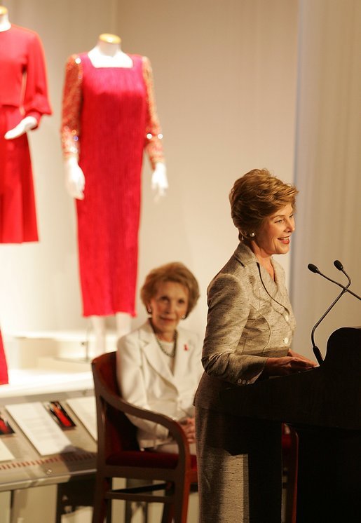 With former First Lady Nancy Reagan looking on, Laura Bush addresses the opening of The Heart Truth’s First Ladies Red Dress Collection Thursday, May 12, 2005, at the John F. Kennedy Center for the Performing Arts in Washington D.C. Mrs. Bush, the ambassador for The Heart Truth, wore her red Carolina Herrera suit to the Bolshoi Theater in Moscow and to The Heart Truth’s Red Dress Collection Fashion Show 2005 in New York City. White House photo by Krisanne Johnson