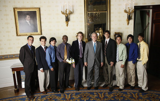 President George W. Bush stands with members of the University of Oregon Men's Cross Country, Tuesday, June 24, 2008, during a photo opportunity with the 2007 and 2008 NCAA Sports Champions. White House photo by Eric Draper