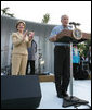 President George W. Bush and Laura Bush are seen on stage as they welcome guests to the annual Congressional Picnic on the South Lawn of the White House, Thursday evening, June 5, 2008, hosted for members of Congress and their families. White House photo by Shealah Craighead