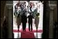 President and Mrs. Bush and President Martin Torrijos of Panama, and Mrs. Torrijos, face the media after the Bush's arrival Monday, Nov. 7, 2005, at the Palacio de Las Garzas in Panama City, Panama. White House photo by Paul Morse