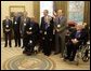 President George W. Bush stands with recipients of the 2005 National Medal of Arts winners Thursday, Nov. 9, 2005, in the Oval Office. Among those recognized for their outstanding contributions to the arts were, from left: Leonard Garment, arts advocate; Louis Auchincloss, author; Paquito D'Rivera, jazzist; James De Preist, symphony conductor; Tina Ramirez, choreographer; Robert Duval, actor, and Ollie Johnston, animator. White House photo by Eric Draper