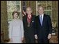 President George W. Bush and Laura Bush stand with 2005 National Humanities Medal recipient Walter Berns, historian, Thursday, Nov. 10, 2005 in the Oval Office at the White House. White House photo by Eric Draper