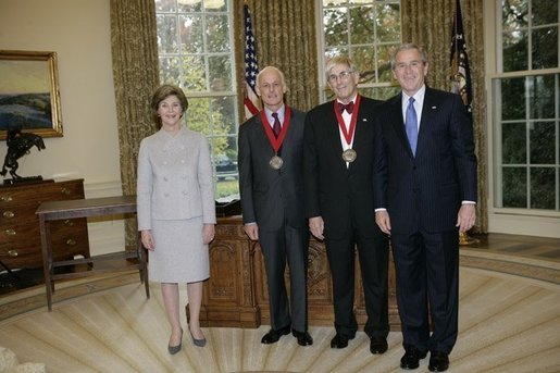 President George W. Bush and Laura Bush stand with 2005 National Humanities Medal recipients Lewis Lehrman and Richard Gilder, Thursday, Nov. 10, 2005 in the Oval Office at the White House. White House photo by Eric Draper