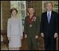 President George W. Bush and Laura Bush stand with 2005 National Humanities Medal recipient U.S. Marine Matthew Bogdanos, also an Assistant District Attorney in New York, Thursday, Nov. 10, 2005 in the Oval Office at the White House. White House photo by Eric Draper