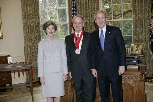 President George W. Bush and Laura Bush stand with 2005 National Humanities Medal recipient John Lewis Gaddis, historian, Thursday, Nov. 10, 2005 in the Oval Office at the White House. White House photo by Eric Draper