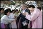 President George W. Bush greets excited participants Thursday, Nov. 17, 2005, during his tour of the Bulguksa Temple in Gyeongju, Korea. White House photo by Eric Draper