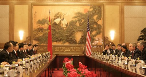 President George W. Bush and the U.S. delegation sit on the right as President Hu Jintao and his Chinese delegation sit on the opposite side during an expanded meeting Sunday, Nov. 20, 2005, at the Great Hall of the People in Beijing. White House photo by Eric Draper