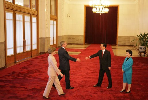 President and Mrs. Bush are greeted Sunday, Nov. 20, 2005, by China's President Hu Jintao and wife, Madame Liu, at the Great Hall of the People in Beijing. White House photo by Paul Morse