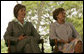 Mrs. Laura Bush and Mrs. Marisa Leticia da Silva listen to remarks by their husbands, during a joint statement at Granja do Torto, home of Brazil President Luiz Inacio Lula da Silva, Saturday, Nov. 6, 2005. White House photo by Paul Morse