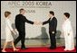 President and Mrs. Bush are welcomed by President Moo Hyun Roh of the Republic of Korea, and his wife, Yang-Sook Kwon, to the Gala Dinner and Cultural Performance at the 2005 APEC summit Friday night, Nov. 18, 2005. White House photo by Paul Morse