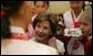 Laura Bush listens to children in the Children's Reading Room of the Busan Simin Metropolitan Municipal Library Friday, Nov. 18, 2005, in Busan, Korea. White House photo by Shealah Craighead