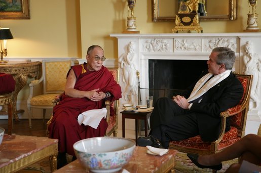 President George W. Bush, wearing a scarf presented to him by the Dalai Lama, meets with the Buddhist spiritual leader Wednesday, Nov. 9, 2005, in the private residence of the White House. White House photo by Paul Morse
