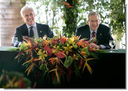 President George W. Bush enjoys a light moment with U.S. Ambassador to Brazil John Danilovich during a roundtable discussion with young leaders from Brazil, Sunday, Nov. 6, 2005 in Brasilia, Brazil. White House photo by Eric Draper