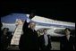 President George W. Bush waves to well-wishers Wednesday, Nov. 16, 2005, after arriving in Busan, South Korea, where he will attend the APEC conference later in the week. White House photo by Eric Draper