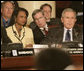 President George W. Bush, Secretary of State Condoleezza Rice and National Security Council Advisor Steve Hadley listen to opening statements Friday, Nov. 4, 2005, at the Summit of the Americas in Mar del Plata, Argentina. White House photo by Eric Draper
