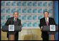 President George W. Bush and Argentina's President Nestor Carlos Kirchner smile as they hold a joint press availability Friday, Nov. 4, 2005, after meeting privately at the Hermitage Hotel in Mar del Plata, Argentina. White House photo by Paul Morse