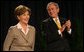 President George W. Bush smiles as Mrs. Laura Bush is introduced Thursday, Feb. 7, 2008, during the National Prayer Breakfast at the Washington Hilton Hotel. White House photo by Joyce N. Boghosian