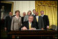 President George W. Bush signs an Executive Order establishing the Interagency Working Group on Youth Programs at the Helping America's Youth Event Thursday Feb. 7, 2008, in the East Room of the White House. The Executive Order is a coalition of Federal agencies that will help support communities and organizations working to help our Nation's youth. White House photo by Chris Greenberg