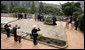 President George W. Bush and Mrs. Laura Bush pause for a moment of silence after laying a wreath on a mass grave at the genocide memorial Tuesday, Feb. 19, 2008, at the Kigali Memorial Centre in Kigali, Rwanda. White House photo by Shealah Craighead