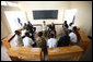 President George W. Bush and Mrs. Laura Bush visit Tuesday, Feb. 19, 2008, with participants who have completed the parent-child communication program, during a meeting at the Lycee de Kigali in Kigali, Rwanda. White House photo by Eric Draper