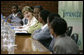 Mrs. Laura Bush joins Rwanda first lady Jeannette Kagame, center, as they listen to students during a forum Tuesday, Feb. 19, 2008 in Kigali, Rwanda, to promote girl's education. White House photo by Shealah Craighead