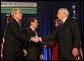 President George W. Bush congratulates Secretary of Agriculture Ed Schafer after he was ceremoniously sworn in Wednesday, Feb. 6, 2008, at the U.S. Department of Agriculture. In the background are Mrs. Nancy Schafer and Deputy Secretary Chuck Conner. White House photo by Chris Greenberg