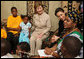 Mrs. Laura Bush joins a discussion with orphans and caretakers at the WAMA Foundation Sunday, Feb. 17, 2008 in Dar es Salaam, Tanzania, during a meeting to launch the National Plan of Action for Orphans and Vulnerable Children. White House photo by Shealah Craighead