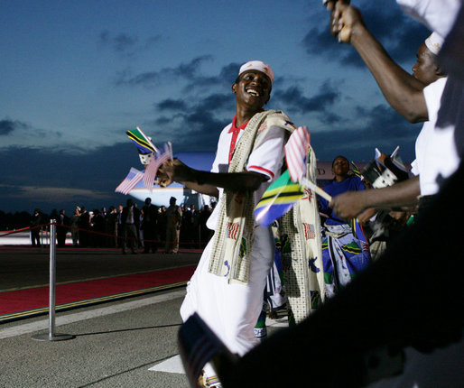 A participant in the welcoming ceremony for President George W. Bush and Mrs. Laura Bush dances near the red carpet at Julius Nyerere International Airport in Dar es Salaam as he rejoices in the arrival of U.S. leader to Tanzania. White House photo by Chris Greenberg