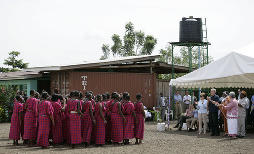 President George W. Bush and Mrs. Laura Bush applaud a dance performance Monday, Feb. 18, 2008, at the Maasai Girls School in Arusha, Tanzania. White House photo by Shealah Craighead