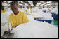 An employee at the A to Z Textile Mills in Arusha, Tanazia, stitches mosquito nets Monday, Feb. 18, 2008, where President George W. Bush and Mrs. Laura Bush toured the mill and visited with employees. White House photo by Shealah Craighead