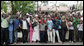 Crowds cheer and wave flags as the motorcade of President George W. Bush and Mrs. Laura Bush travel Monday, Feb. 18, 2008 to the Meru District Hospital in Arusha, Tanzania. White House photo by Shealah Craighead