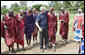 President George W. Bush thanks a Maasai warrior dance group for their performance in welcoming President Bush and Mrs. Laura Bush Monday, Feb. 18, 2008, to the Maasai Girls School in Arusha, Tanzania. White House photo by Eric Draper