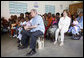 President George W. Bush and Mrs. Laura Bush join children and their families in the pediatric outpatient clinic Monday, Feb. 18, 2008, at the Meru District Hospital in Arusha, Tanzania. White House photo by Eric Draper