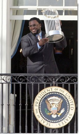 Boston Red Sox's slugger David Ortiz raises the 2007 World Championship Trophy for the crowd during a ceremony honoring the Boston Red Sox Wednesday, Feb. 27, 2008, at the White House. White House photo by Joyce N. Boghosian