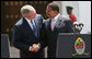 President George W. Bush and President Jakaya Kilwete of Tanzania shake hands following their joint press availability Sunday, Feb. 17, 2008, at the State House in Dar es Salaam, Tanzania. White House photo by Chris Greenberg